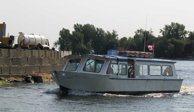 [Dorval Island Ferry with Water Pipe Tunnelling Equipment on Parking Lot]